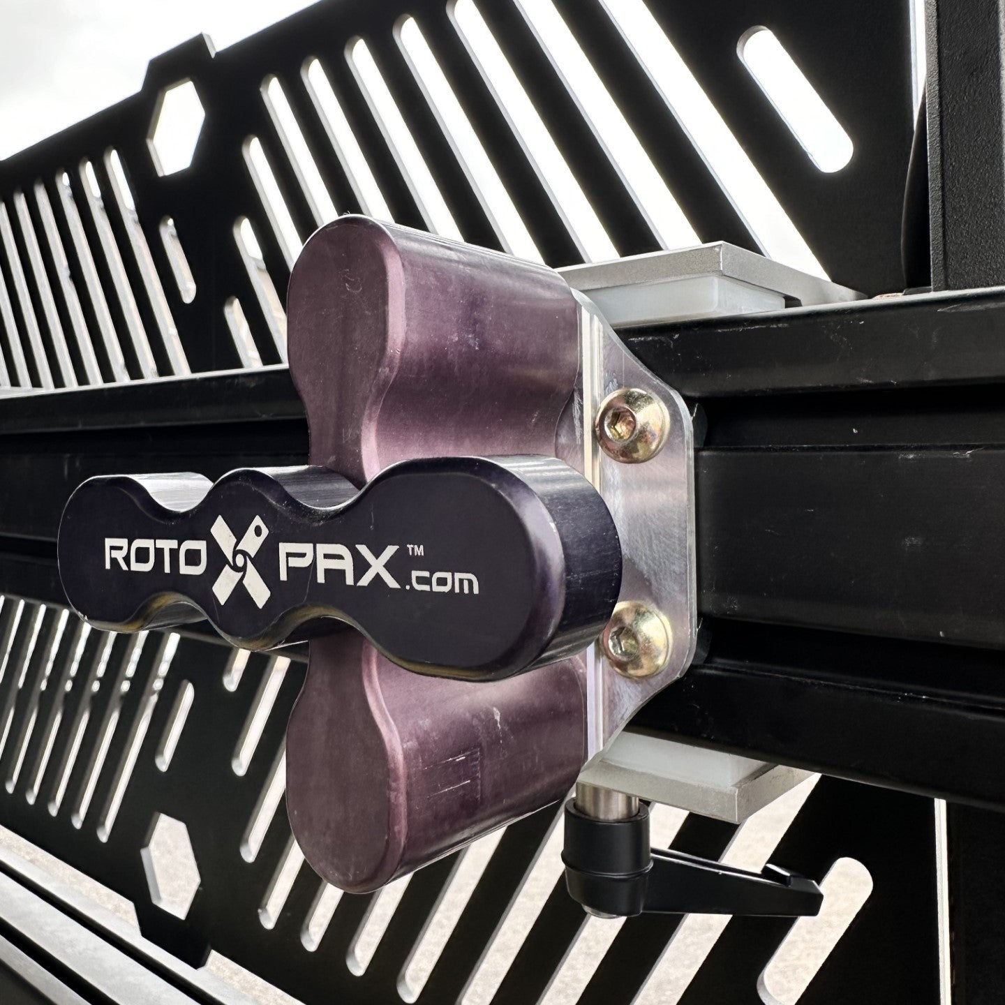 RotoX PAX product attached to a vehicle grille with branding visible.